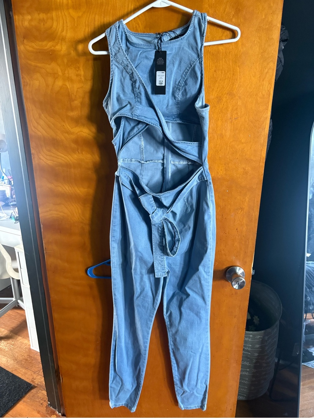 Fashion Nova Light Wash Denim Jumpsuit with Cut-Out Detail